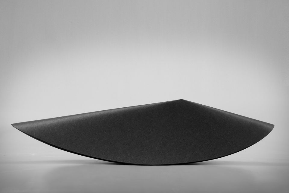 Armen Agop — black granite sculpture, sharp chine, angular profile